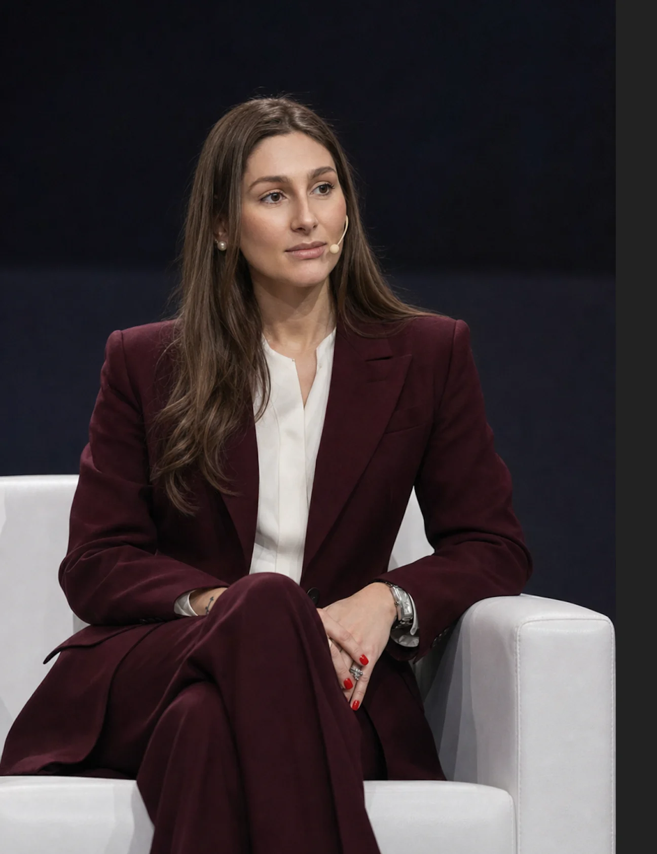 Nina Quisinski durante participação em painel executivo.